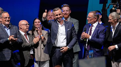 German chancellor faces tough times after first far-right party's state election win since Nazi era 
