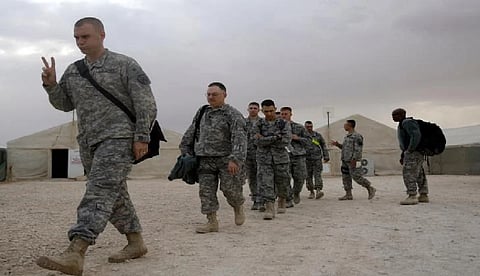 As the last US troops pack up in Iraq, militias signal their weapons will stay