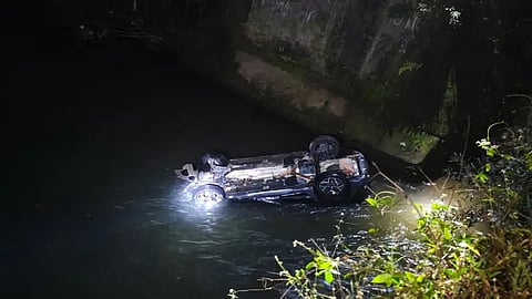 Man dies, three injured as car plunges into river