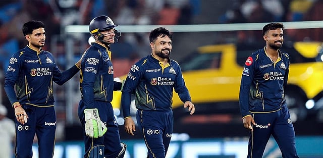 Rasheed Gill Gill, Rashid star as GT crush RR by 77 runs