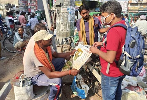 A representative giving information about India Labour line at Vikas Nagar Labour Chowk in Lucknow/Photo - Arun Verma, The Mooknayak