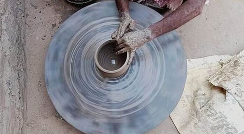 An earthen vessel being turned on the potter’s wheel by Firoze [Photo- Azaruddin, The Mooknayak]
