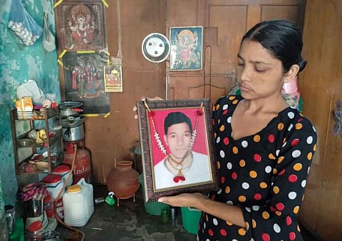 His wife Pinky with Rohit's picture in hand [Photo- Saurav Singh, The Mooknayak]