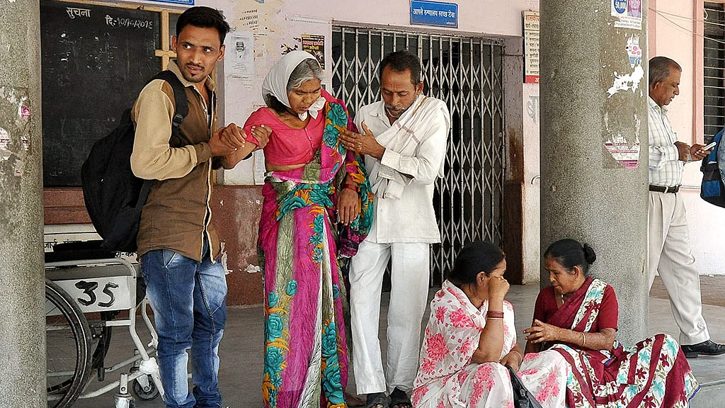 Patients wait outside the OPD at GMC Hospital as resident doctors were
on a strike in Nagpur on Friday, March 24