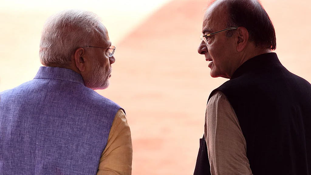 File photo of Prime Minister Narendra Modi seen talking with Union Finance Minister Arun Jaitley. About 40 amendments were sneaked into Finance Bill 2017 before it was passed by the Lok Sabha without much debate