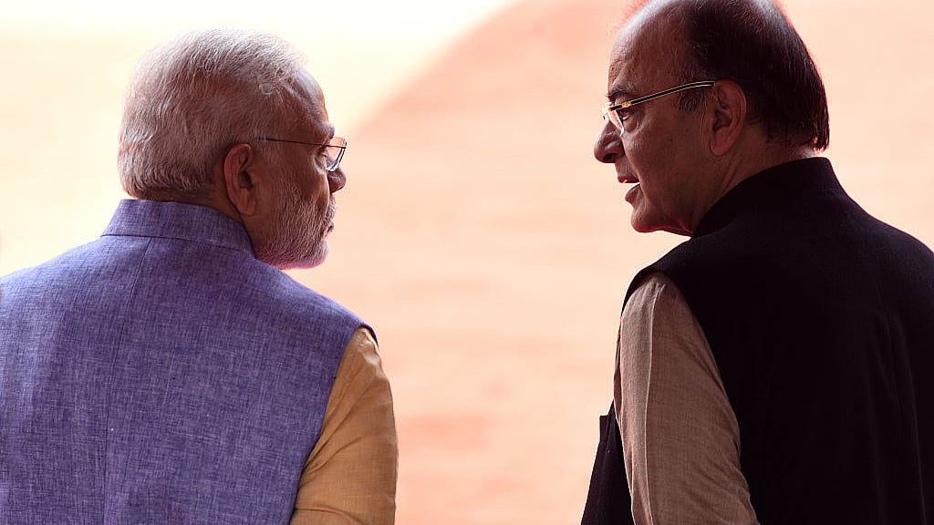 File photo of Prime Minister Narendra Modi seen talking with Union Finance Minister Arun Jaitley. About 40 amendments were sneaked into Finance Bill 2017 before it was passed by the Lok Sabha without much debate