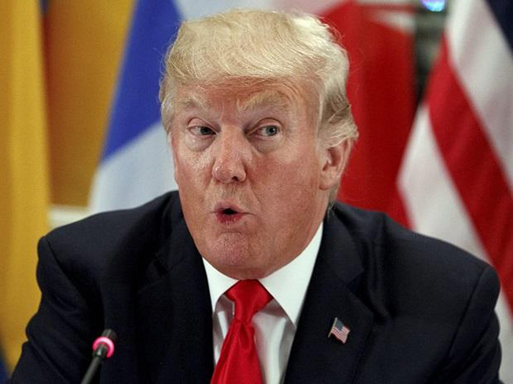 Trump visits US-Mexico border, reiterates demand for wall  