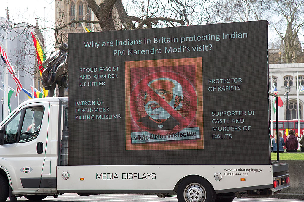 #ModiNotWelcome posters greet the Indian PM on the first day of his UK visit