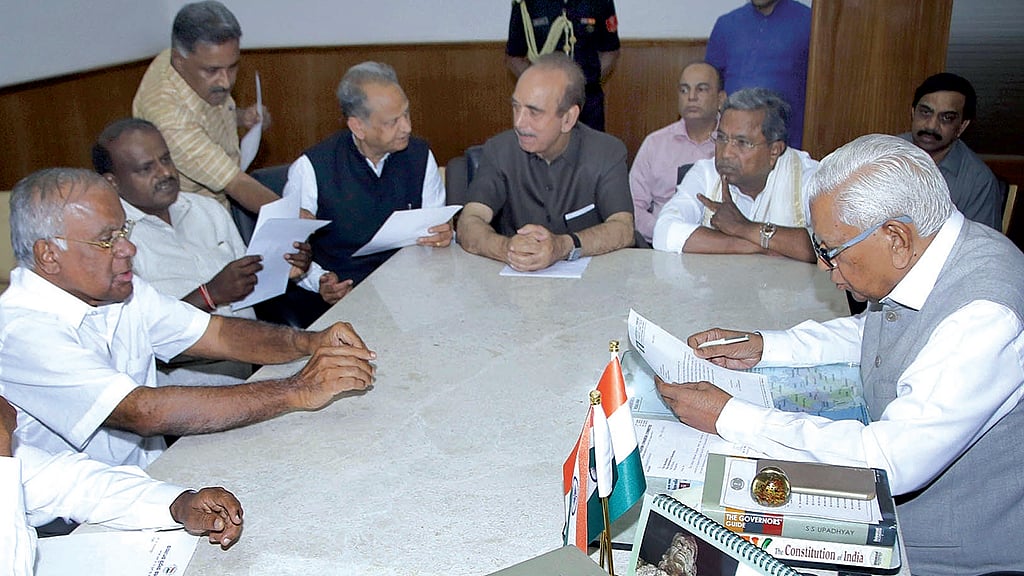 File photo of Congress leaders Ghulam Nabi Azad, Ashok Gehlot and Siddaramaiah along with JD(S) leader HD Kumaraswamy meeting Karnataka Governor Vajubhai Vala at Raj Bhavan in Bengaluru