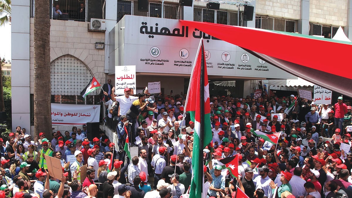 Hundreds of Jordanians gather to protest against a controversial income tax bill, amid chants fordissolving parliament in Amman, Jordan on June 6, 2018