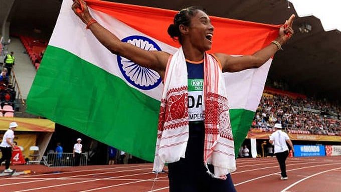 Hima Das celebrates after winning gold in women’s 400m at the IAAF World U-20 Championships