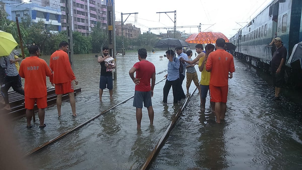  Rains batter Mumbai for fourth day, NDRF rescues stranded rail passengers