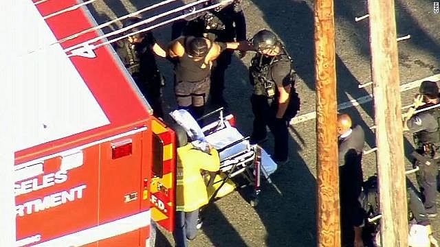 Woman dies in Los Angeles store siege, gunman nabbed  