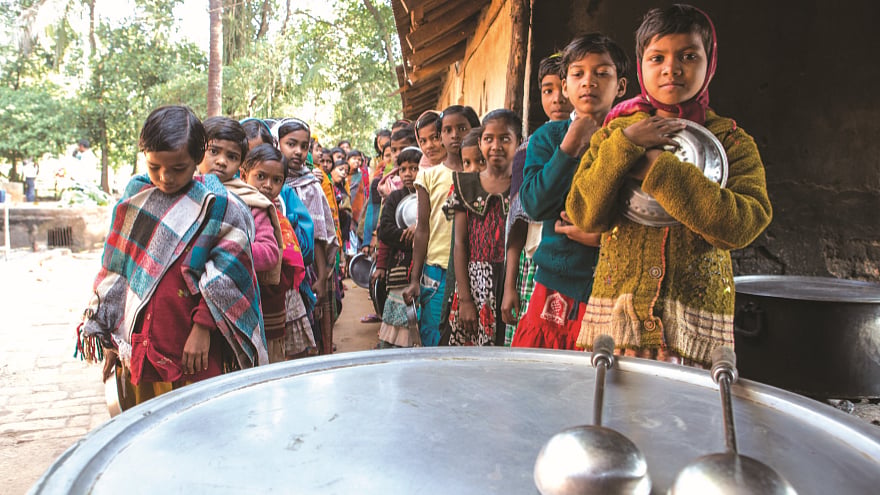 School children wait in lines for lunch 