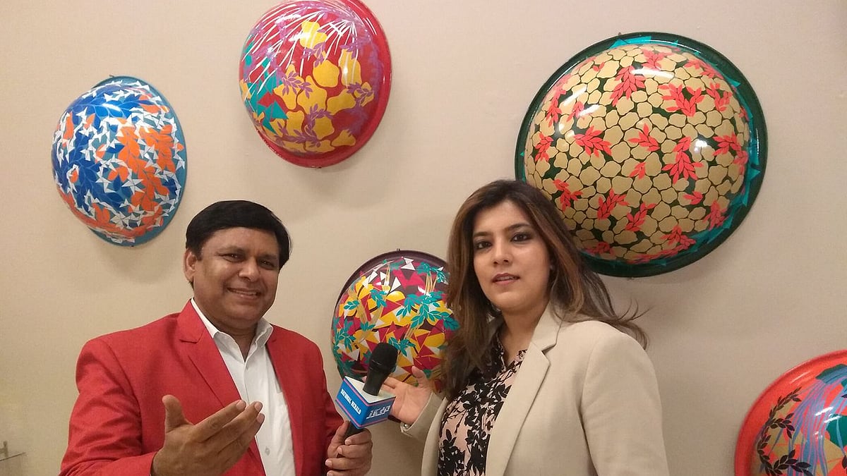 Qazi M Raghib with the curator of the exhibition Sahar Zaman