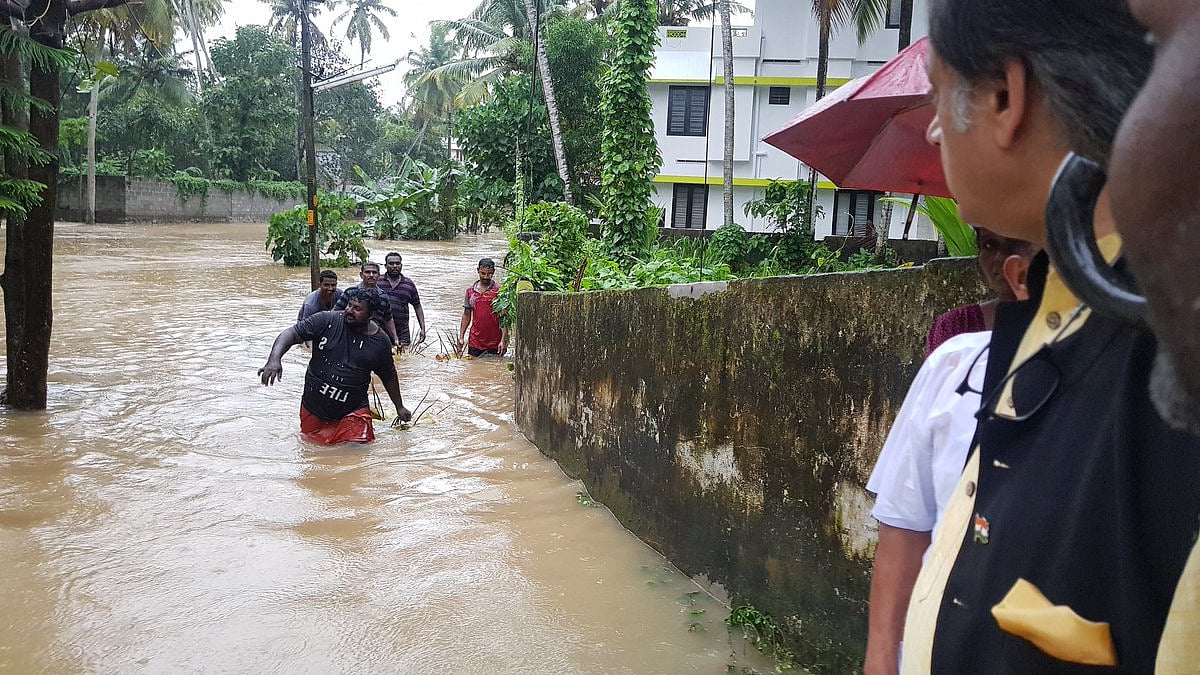 Congress MP Shashi Tharoor in flooded streets of his constituency Thiruvananthapuram, as the city braces for worse overnight. Many areas have no power or drinking water, said Tharoor