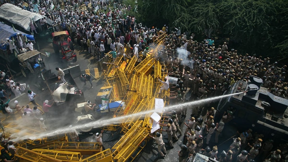 Police use water cannons on protesting farmers at the Delhi-UP border as they try to enter the National Capital to demand farm loan waivers from the Centre