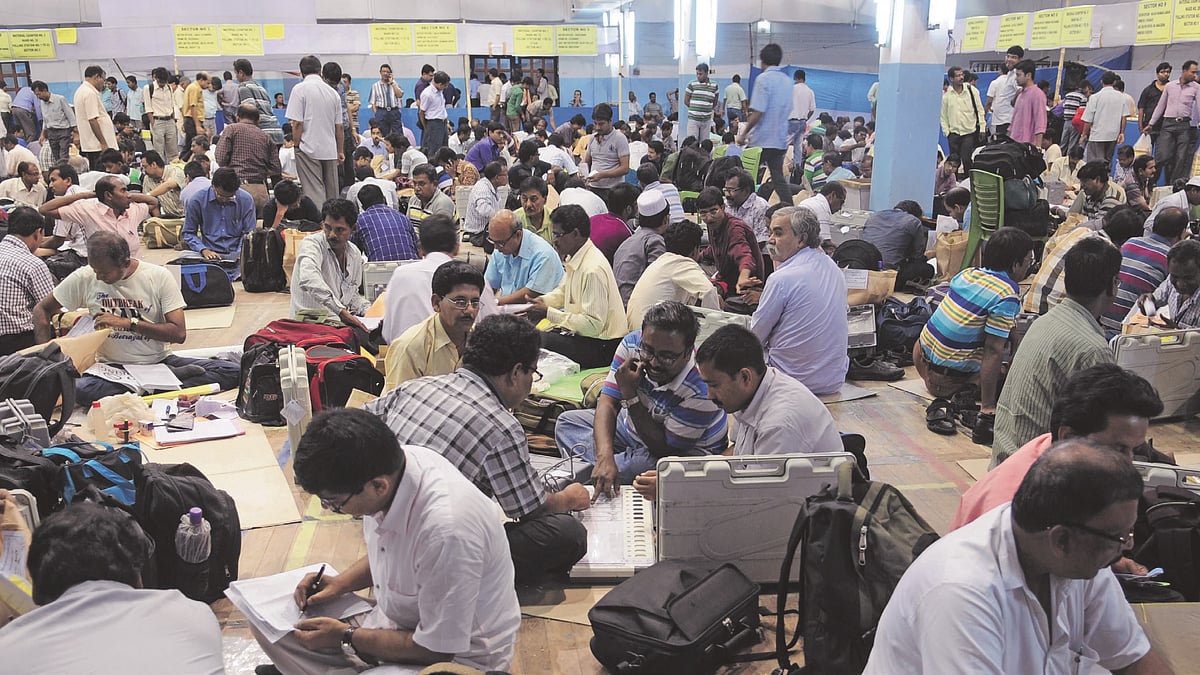 Election officials readying the EVMs and VVPATs