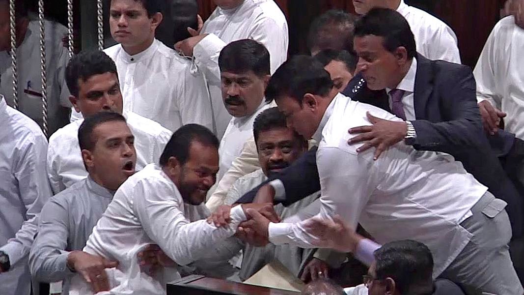  In this image made from video, Sri Lanka’s lawmakers scuffle at the parliament in Colombo &nbsp;