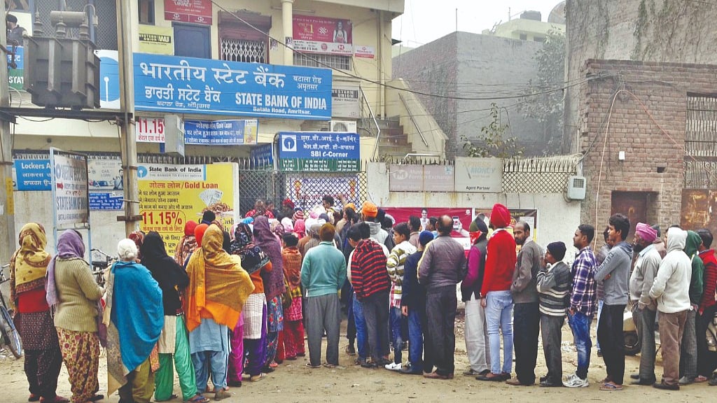 Despite cold weather in North India, people queued up outside their bank branches to get cash in the winter of 2016 