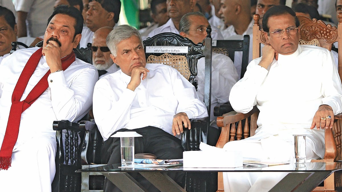 From Left: A file picture of former Sri Lankan President Mahinda Rajapaksa, deposed Sri Lankan Prime Minister Ranil Wickremesinghe and Sri LankanPresident Maithripala Sirisena