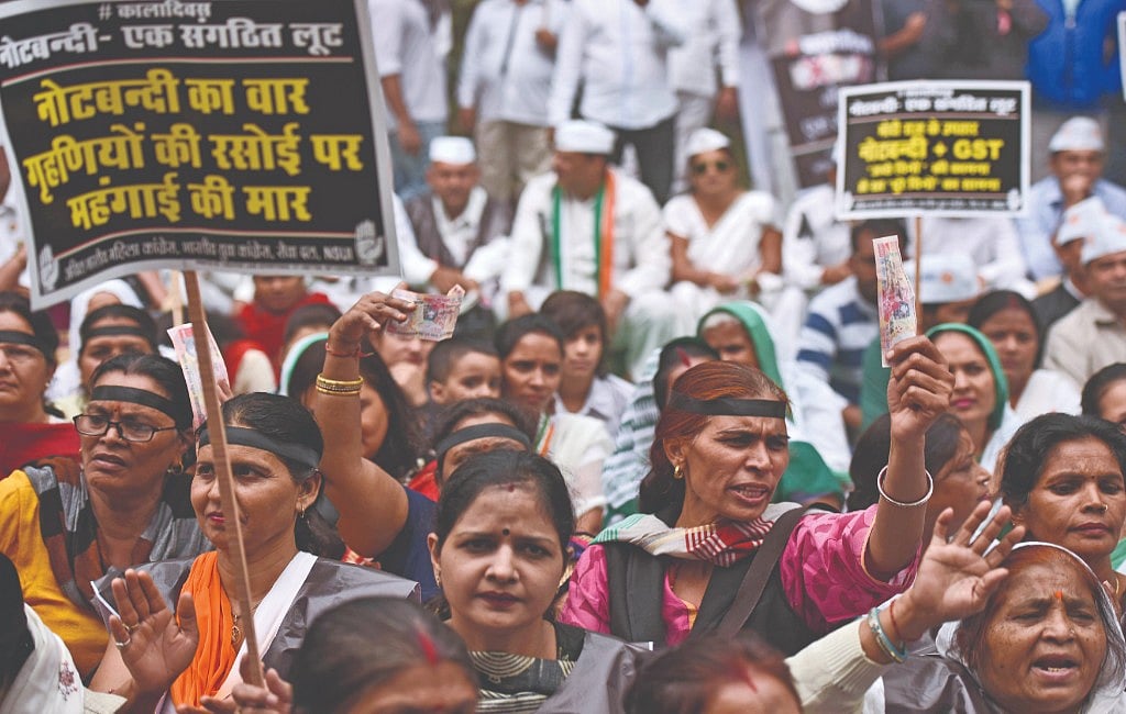 Cashless economy brought about by demonetisation hurt the poor and the economy