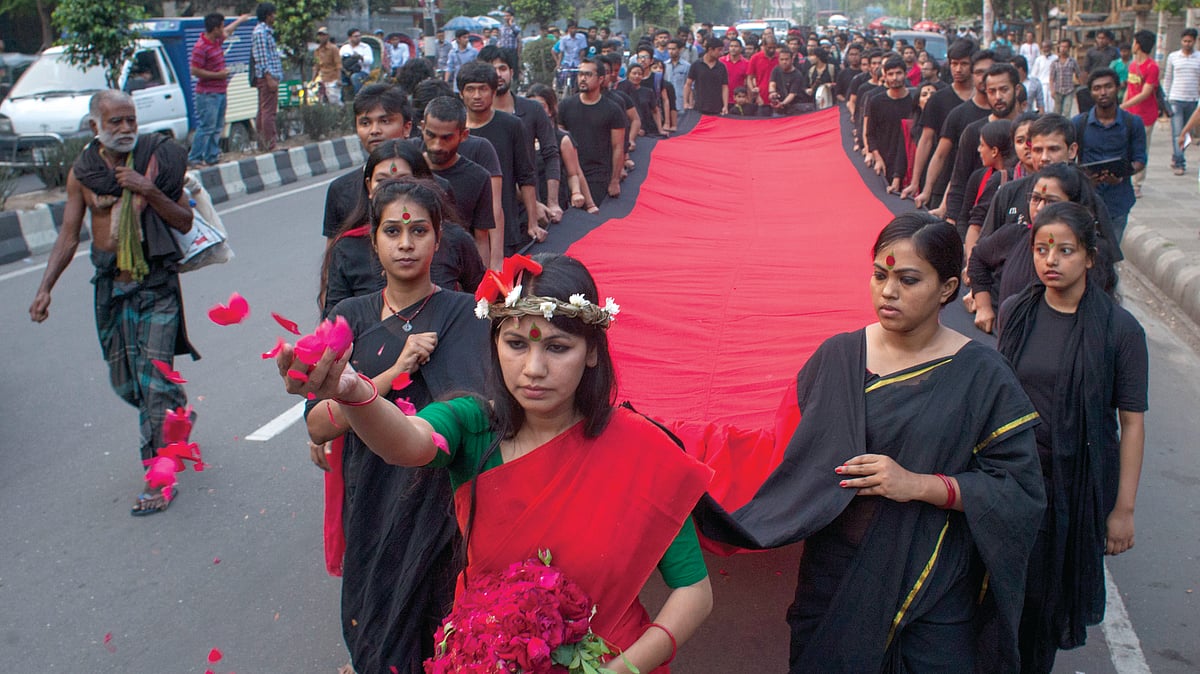Students of Prachyanat School of Acting and Design take out a Lal Jatra procession in remembrance of ‘Black Night 1971’ in Dhaka, Bangladesh 