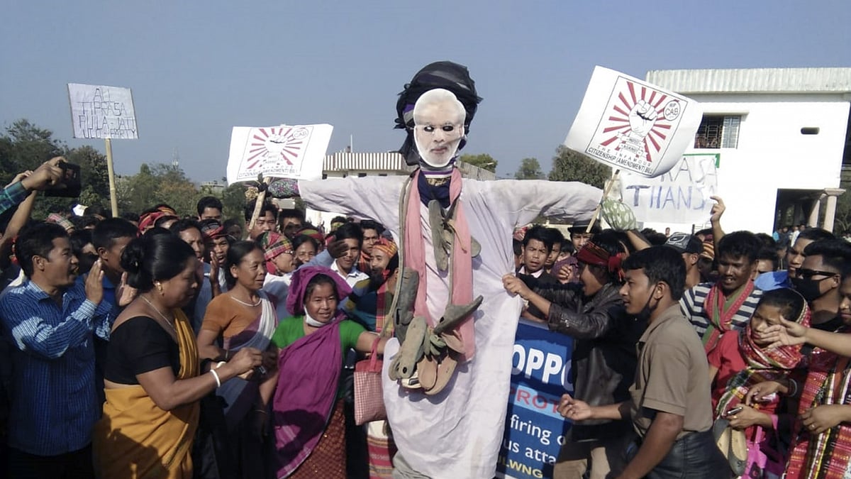 Members of various tribal parties of Tripura stage a demonstration against police firing on people protesting against the Citizenship (Amendment) Bill, in Khumulwng