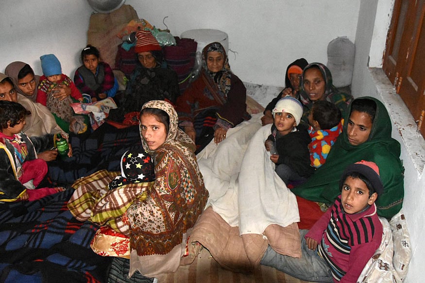 Villagers take shelter at a shrine after shelling by the Pakistani Army near the Line of Control (LoC), at Mendhar in Poonch district.