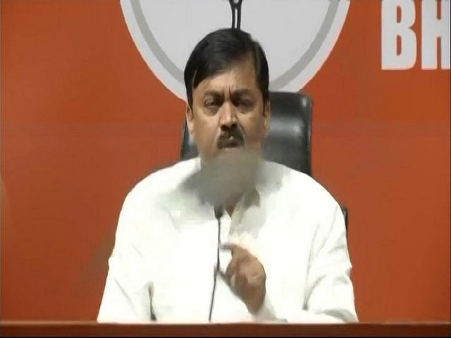  Man hurls shoes at BJP leader GVL Narsimha Rao during press conference