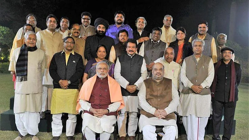 BJP’s candidate from Agra SP Singh Baghel (fourth from right, standing) in a file photo also featuring PM Modi and BJP President Amit Shah