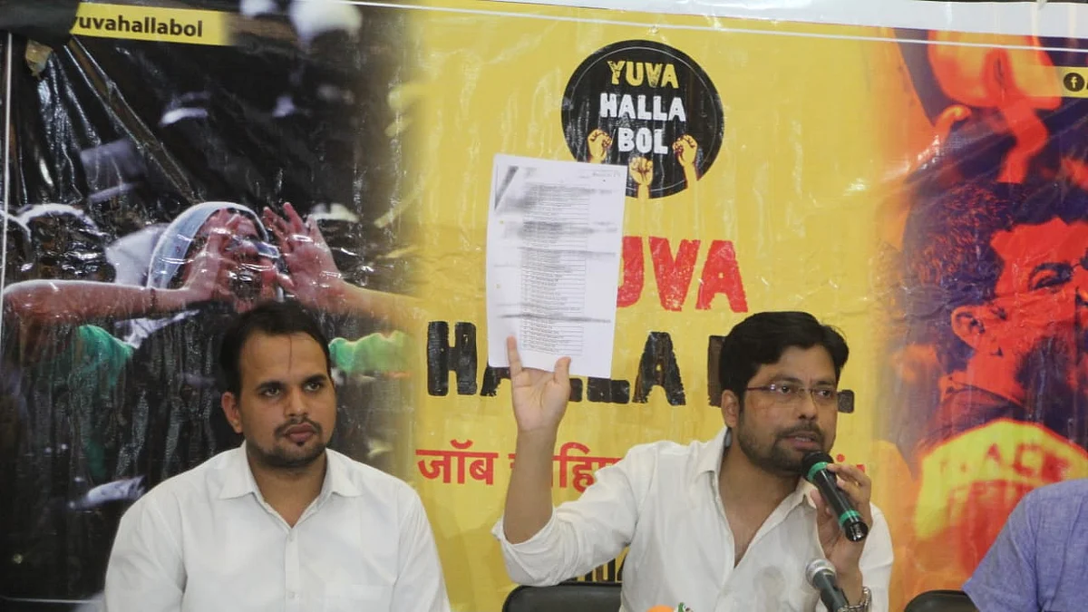 Swaraj India leader Anupam (holding up a document) said that an RTI reply had revealed that the appointment of SSC Chairman Ashim Khurana was in violation of rules/ NH photo by Vipin