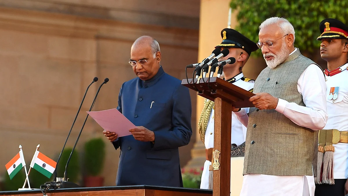 President Ram Nath Kovind administering the oath of office of the Prime Minister to Narendra Modi, at theswearing-in ceremony at Rashtrapati Bhavan in New Delhi on May 30.