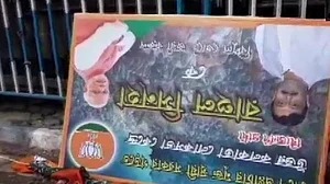 A removed banner of the BJP lying on the road in Kolkata (Twitter: @ANI)