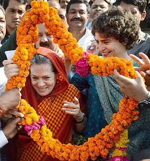 Sonia Gandhi and Priyanka Gandhi Vadra being welcomed by supporters (file photo).