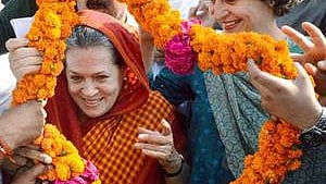 Sonia Gandhi and Priyanka Gandhi Vadra being welcomed by supporters (file photo).