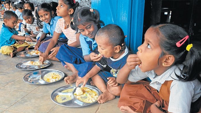 Children having their mid-day meal at a school.