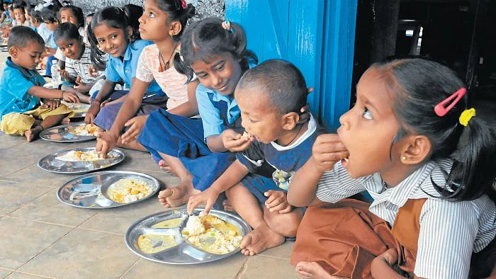 Children having their mid-day meal at a school.