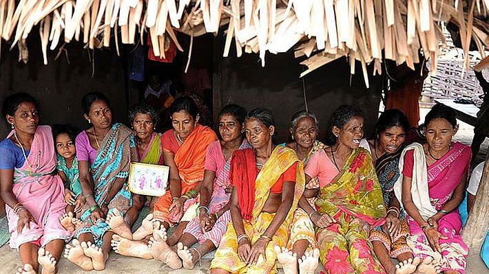Women seated under the canopy of a hut (Photo: PTI)