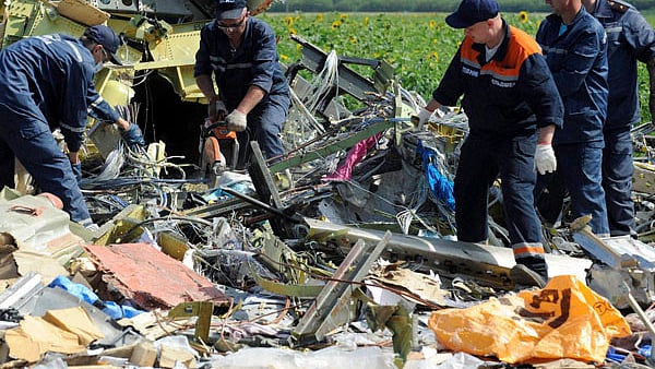 Investigators sift through the  debris of MH17 that was shot down in Ukrainian airspace on July 17, 2014 .