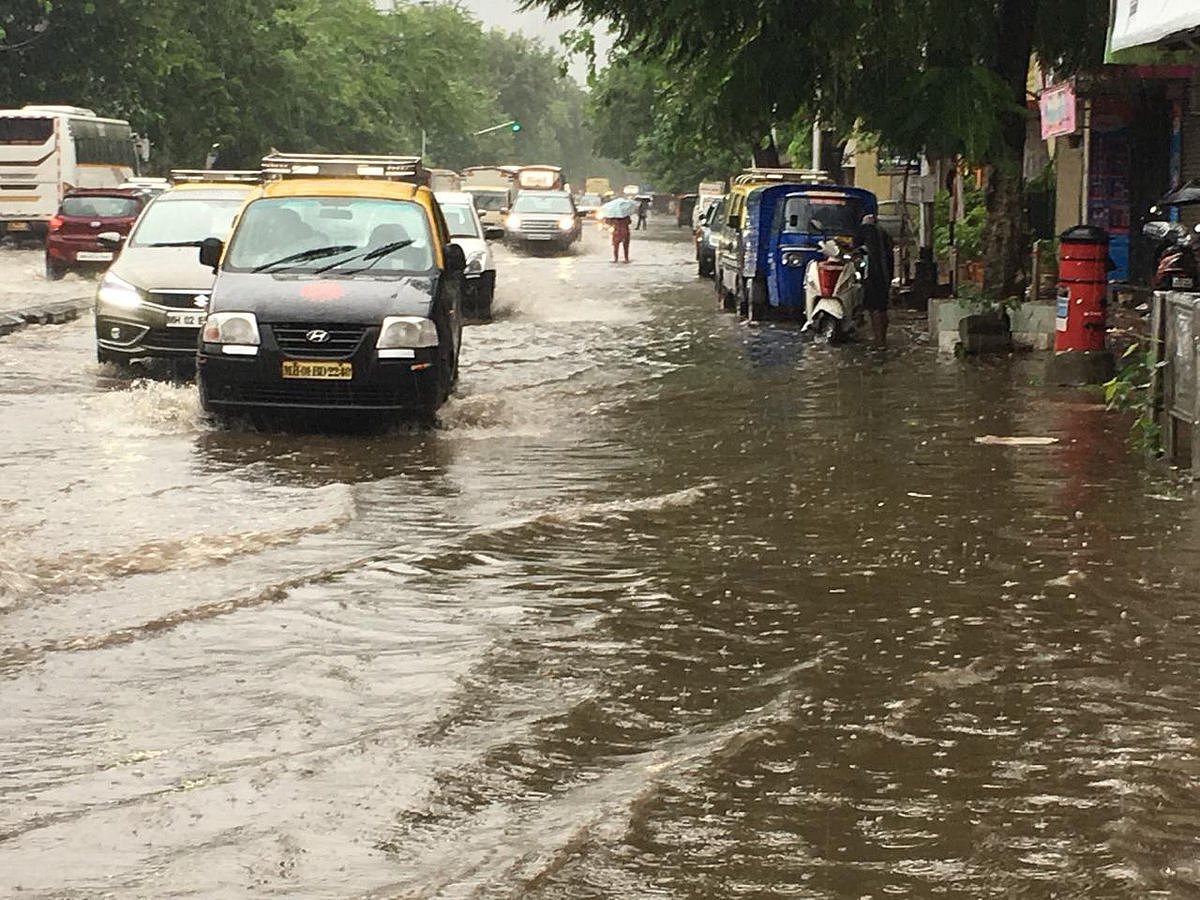 Heavy rain lashes Mumbai, roads waterlogged, tracks flooded, trains delayed