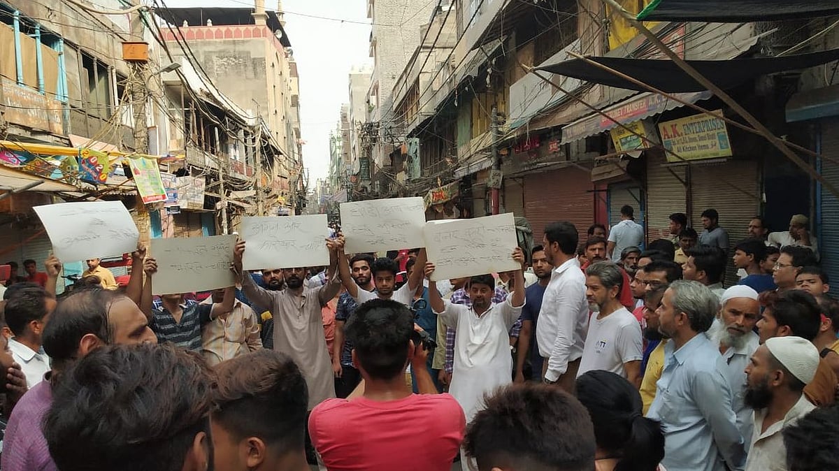 Young Muslim men hold placards advocating for peace