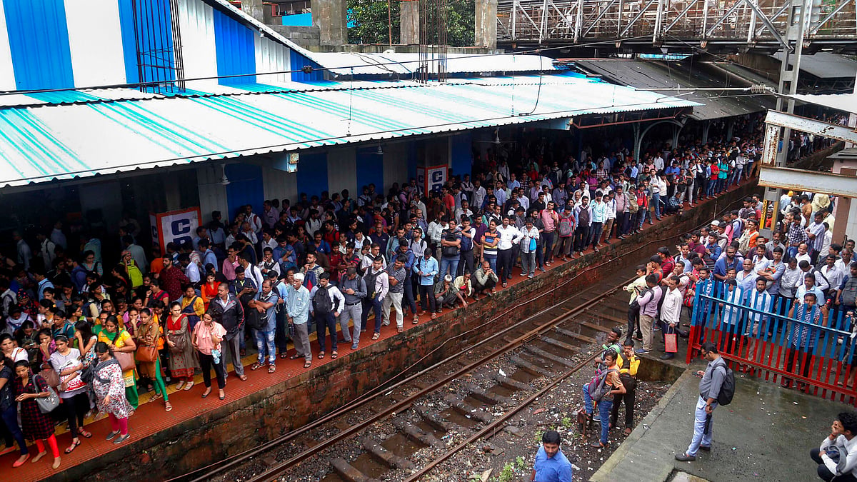 Thane: Passengers stranded at Thane railway station after heavy monsoon rains hit the local train services, in Thane, Monday, Aug 05, 2019. (PTI Photo)(PTI8_5_2019_000083B)