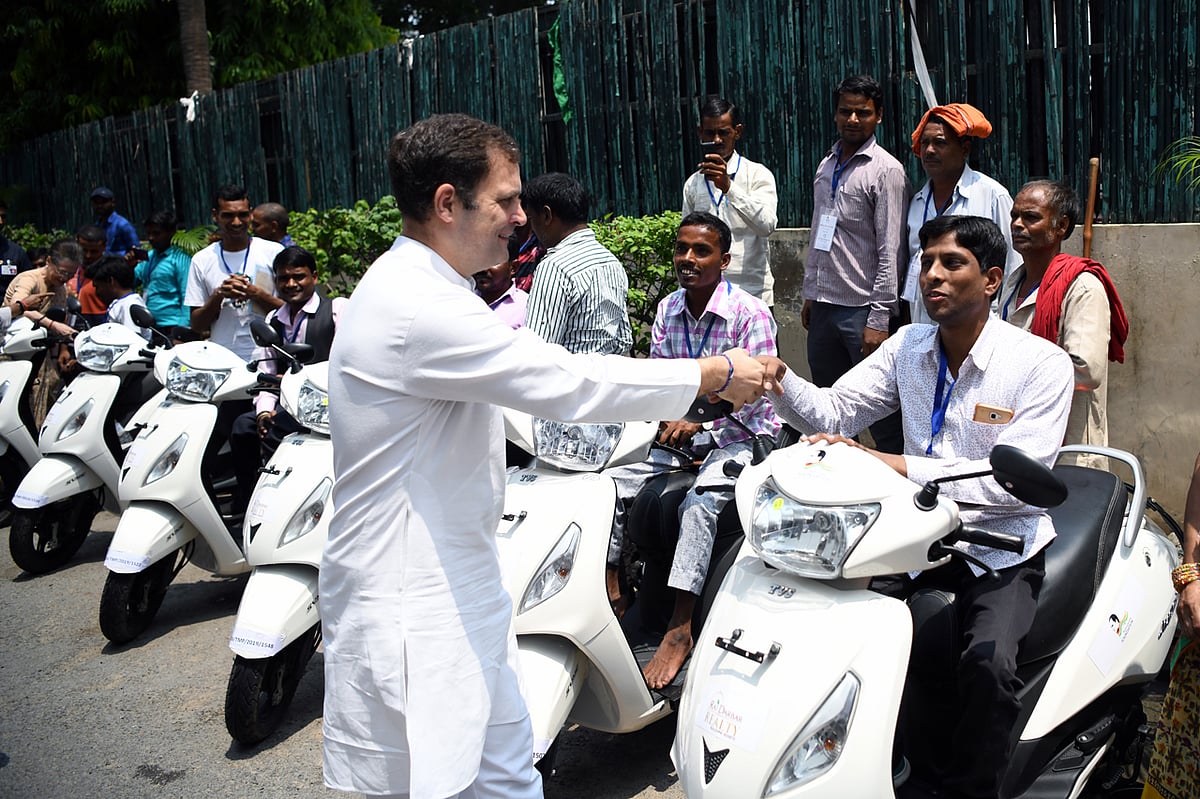 Rahul Gandhi hands over keys of specially designed vehicles to differently abled youth.