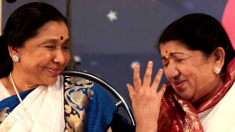 Two legends: Asha Bhosle with elder sister Lata Mangeshkar (file photo)