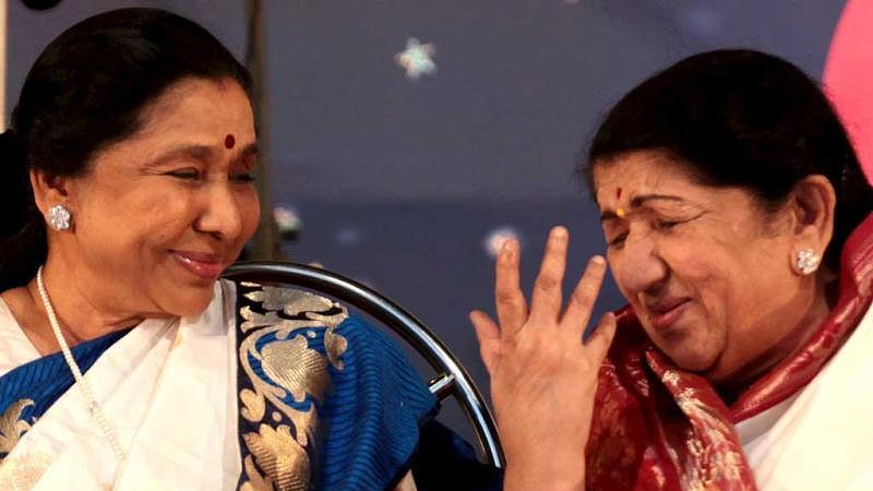 Two legends: Asha Bhosle with elder sister Lata Mangeshkar (file photo)