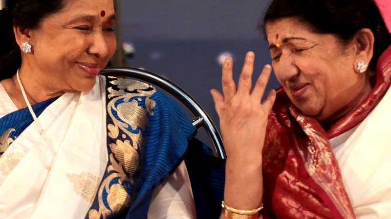Two legends: Asha Bhosle with elder sister Lata Mangeshkar (file photo)