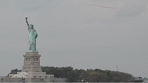Plane over Statue of Liberty