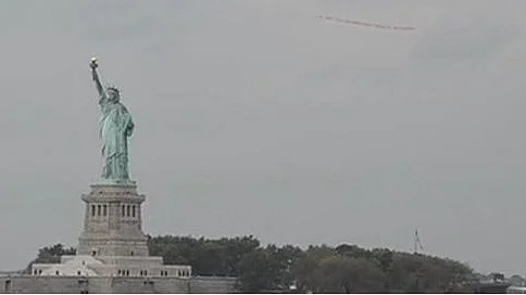 Plane over Statue of Liberty