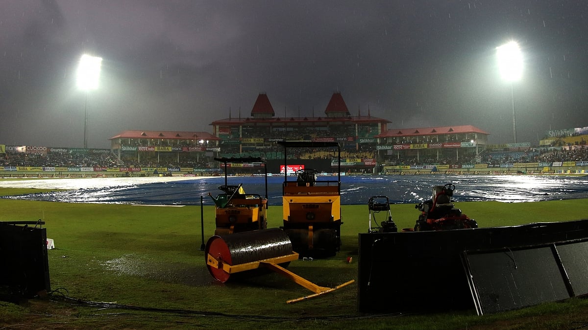 A view of the pitch at Dharamsala cricket stadium covered with plastic sheets during rains ahead of the first T20I match between India and South Africa on Sep 15, 2019. (Photo: Surjeet Yadav/IANS)
